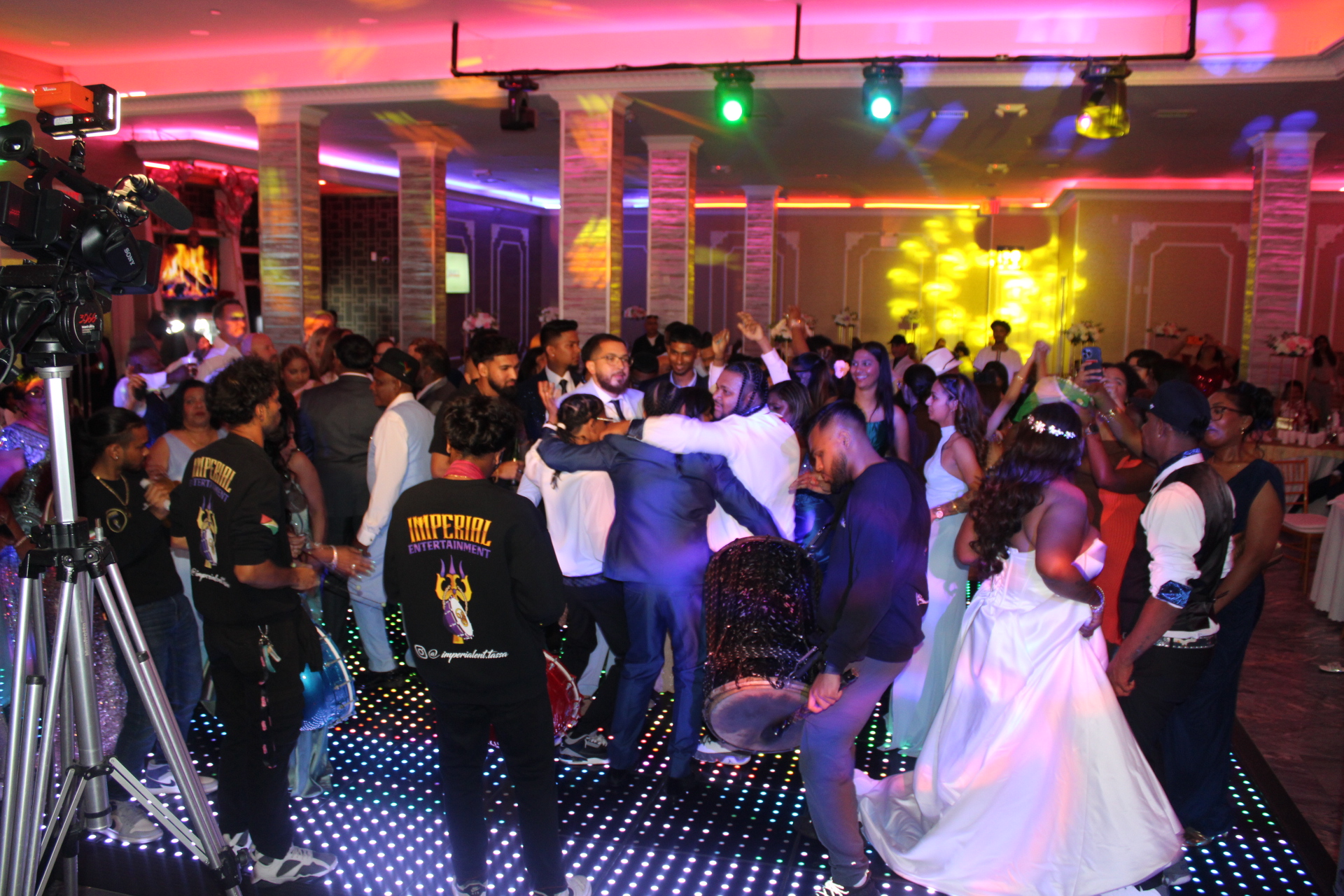 Indian wedding reception dance floor with tassa drummers