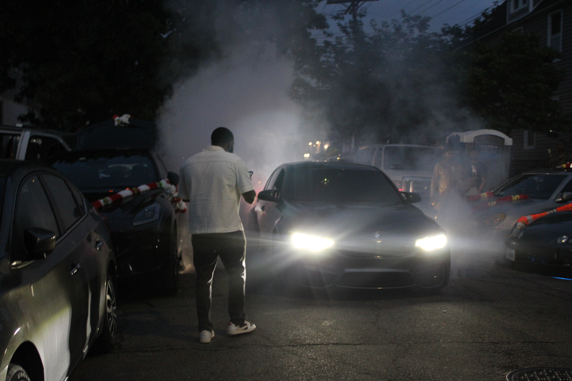 Night motorcade with smoke effects